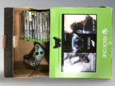 An Xbox-1 in box together with further games and hand controller