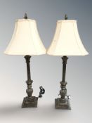 A pair of classical style table lamps,
