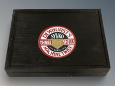 A wooden thread box with advertising decoration