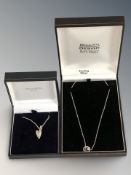 A silver necklace with silver half moon and star pendant, and a further silver heart necklace,