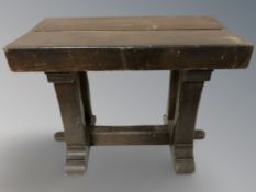 A stained pine stool, width 61 cm.