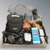 A box of cameras, Pentax, Fuji video camera, NIkon lens,