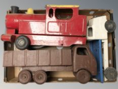 A box containing three vintage metal vehicles, nursery vehicles.