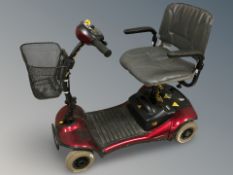 An electric Shoprider mobility scooter with key.
