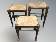 Three rush seated oak stools.