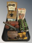 A group of tin plate and vintage toys including Ranch phone, bus, tin plate tractor,