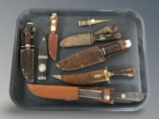 A small group of daggers and knives, hunting knives in leather sheath, etc.