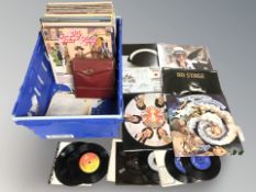 A crate of vinyl records to include Elvis, Paul Williams, Phil Colins, compilations,