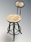 A circular swivel bar stool.