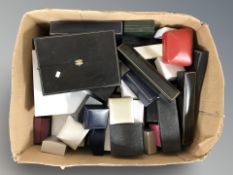 A box containing empty jewellery boxes and ring boxes.