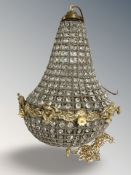A crystal effect brass light fitting