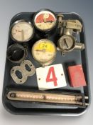 A group of brass gauge, pressure gauge,