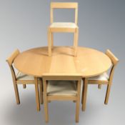 A contemporary Habitat light beech extending table and four chairs