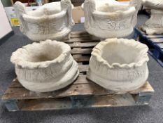 A pair of concrete sack planters.