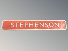 A vintage galvanised metal railway sign, titled 'Stephenson', length 85 cm.