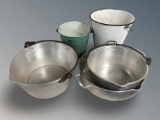 A group of stainless steel, aluminium and enameled buckets and cooking vessels.