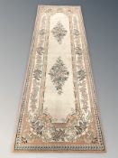 A contemporary flower patterned runner,