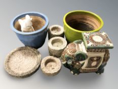 A group of garden ornaments including elephant plant stand, ceramic planters, etc.