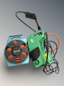 A Gardina hose reel and a pressure washer.