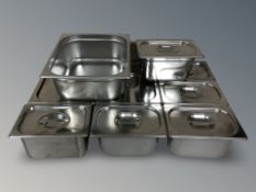 A group of stainless steel bain marie pots