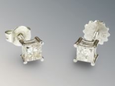 A pair of 18ct white gold square cut diamond stud earrings, 0.8g.