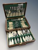 A walnut canteen of silver plated cutlery, with key.