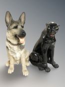 A resin figure of an alsation and panther ornament