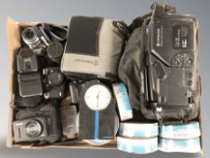 A box of cameras, Olympus OM-D camera, Canon, Sony Dvd-r's,