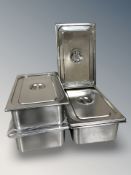 A group of stainless steel bain maries with lids