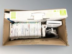 A Wii fit plus in box together with quantity of games,