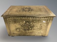 A brass embossed coal box