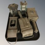 A group of antique car lamps and further shades.