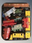 A group of vintage and later tin plate model railway rolling stock and carriages.