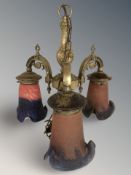 A cast brass and two tone glass light fitting.