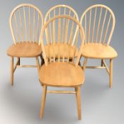 Four hardwood kitchen chairs.
