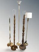 A group of standard lamps, examples in onyx, wood and brass.