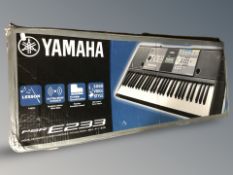 A Yamaha digital keyboard PSR E233 in box