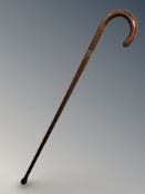A walking stick with 9ct gold collar, engraved 'E Brough', length 91 cm.