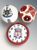 A Coca-cola football together with Newcastle United football and Liverpool FC wall clock
