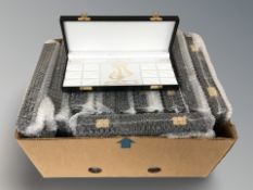 A box of jewellery boxes and ring boxes.