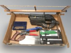 A box of large metal vice, Allen keys, saw,