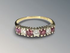 An 18ct gold ruby and diamond half-eternity ring, size N CONDITION REPORT: 1,
