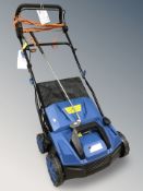 A Hyundai electric sweeper, together with a golf club.