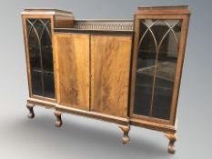 An Edwardian mahogany break-fronted bookcase,