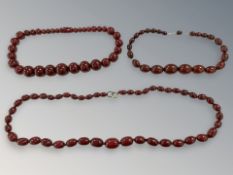 Three cherry amber / Bakelite necklaces CONDITION REPORT: Graduated necklace with