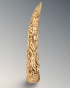 A carved resin tusk