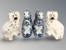 A pair of Beswick dog figures and a pair of blue and white greyhounds