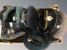 A box of reproduction military related caps