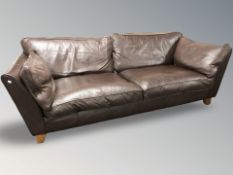 A contemporary brown leather three seater settee, width 223 cm.