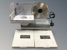 An Andrew James food slicer with spare blades
